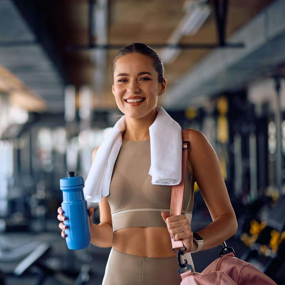 Happy woman in the gym