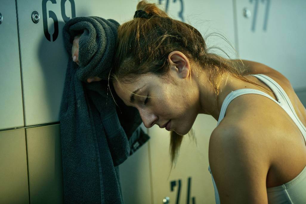 Tired woman after gym session