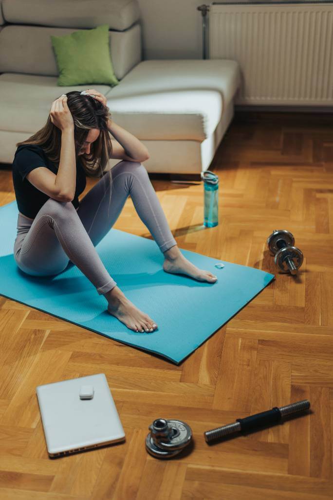 Tired woman frustrated with workout session