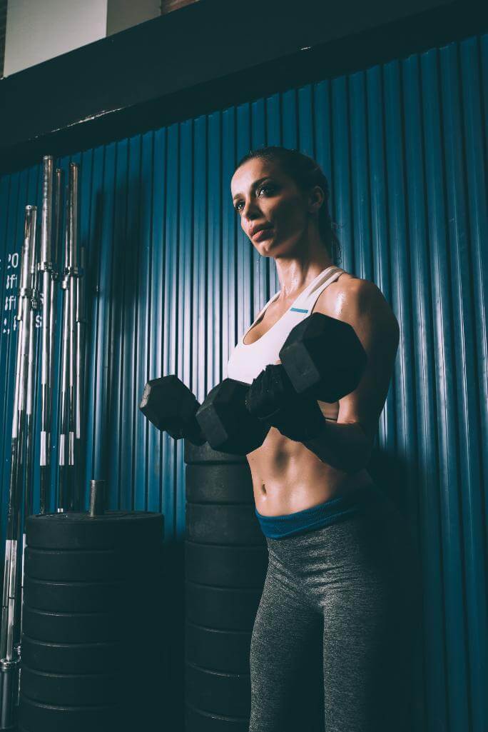 Woman lifting dumbbells