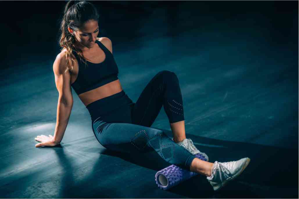 Woman relaxing with foam roll