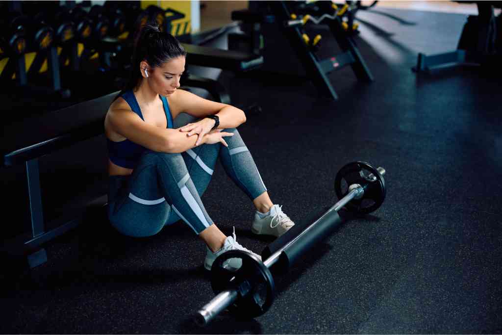Young woman resting in the gym